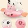 Simann Products Badspeelgoed Koe - Opwindbaar Bad/Zwembad Speelgoed - Kleur Roze - Water Spuitende Koe - Baby En Peuter